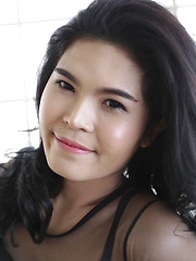 23 year old horny Thai ladyboy with raven hair andfake boobs striptease